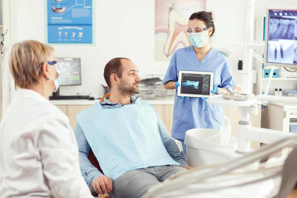 Laser teeth whitening treatment being applied by a dental professional Dundee